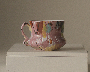A hand-painted teacup shown with its provenance note in Ethereal
